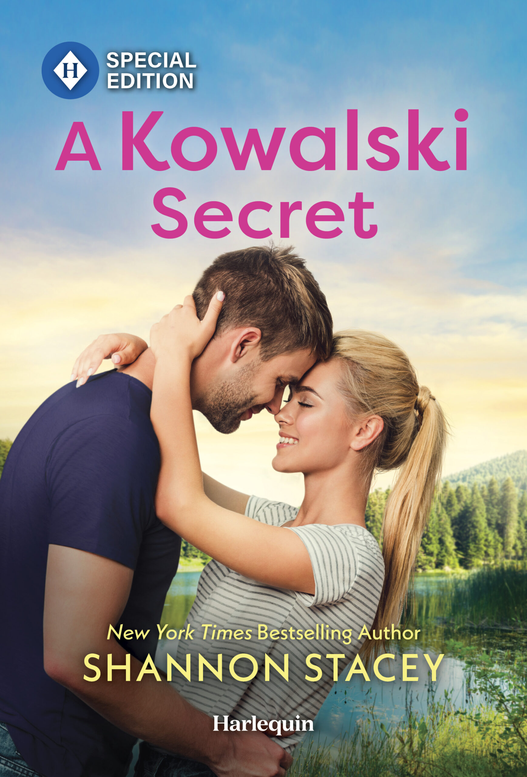 Cover for A Kowalski Secret by Shannon Stacey. The image is of two people in summer T-shirts, with a dark haired man leaning down to touch his forehead to that of a woman with a long blonde ponytail while she cups the back of his neck. Woods in the background.